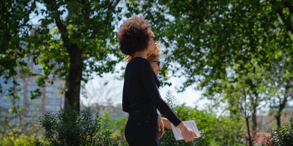 two women walking in the park on a sunny day anxiety remedy